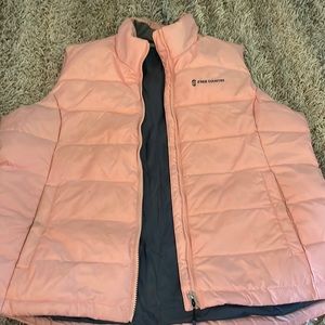 Slick material. Lightweight but warm. Has wear but still looks good.